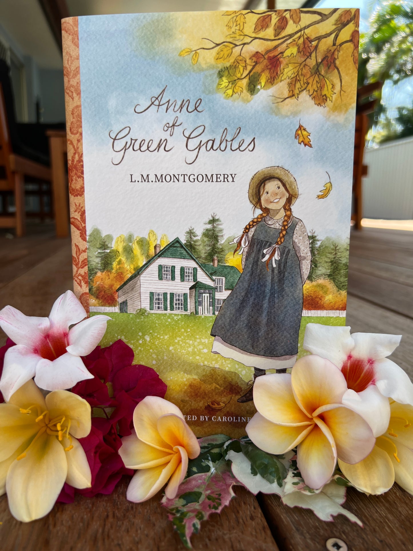 Classic Book Anne of Green Gables, dust jacket art and flowers